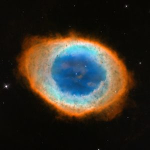The Ring Nebula is formed from the discarded shell of a dying star. The star itself can be seen at the center of the image.