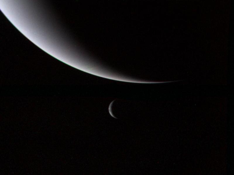 View of the crescents of Neptune and Triton by voyager 2. NASA/JPL