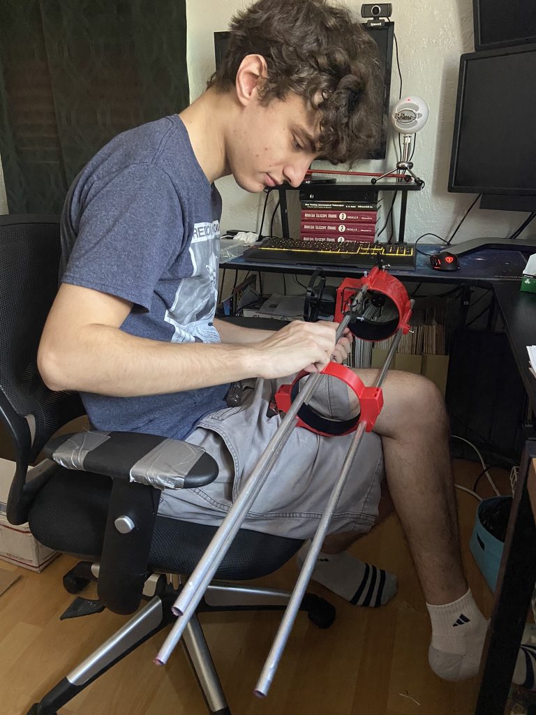 Zane Landers working on a telescope mount tripod