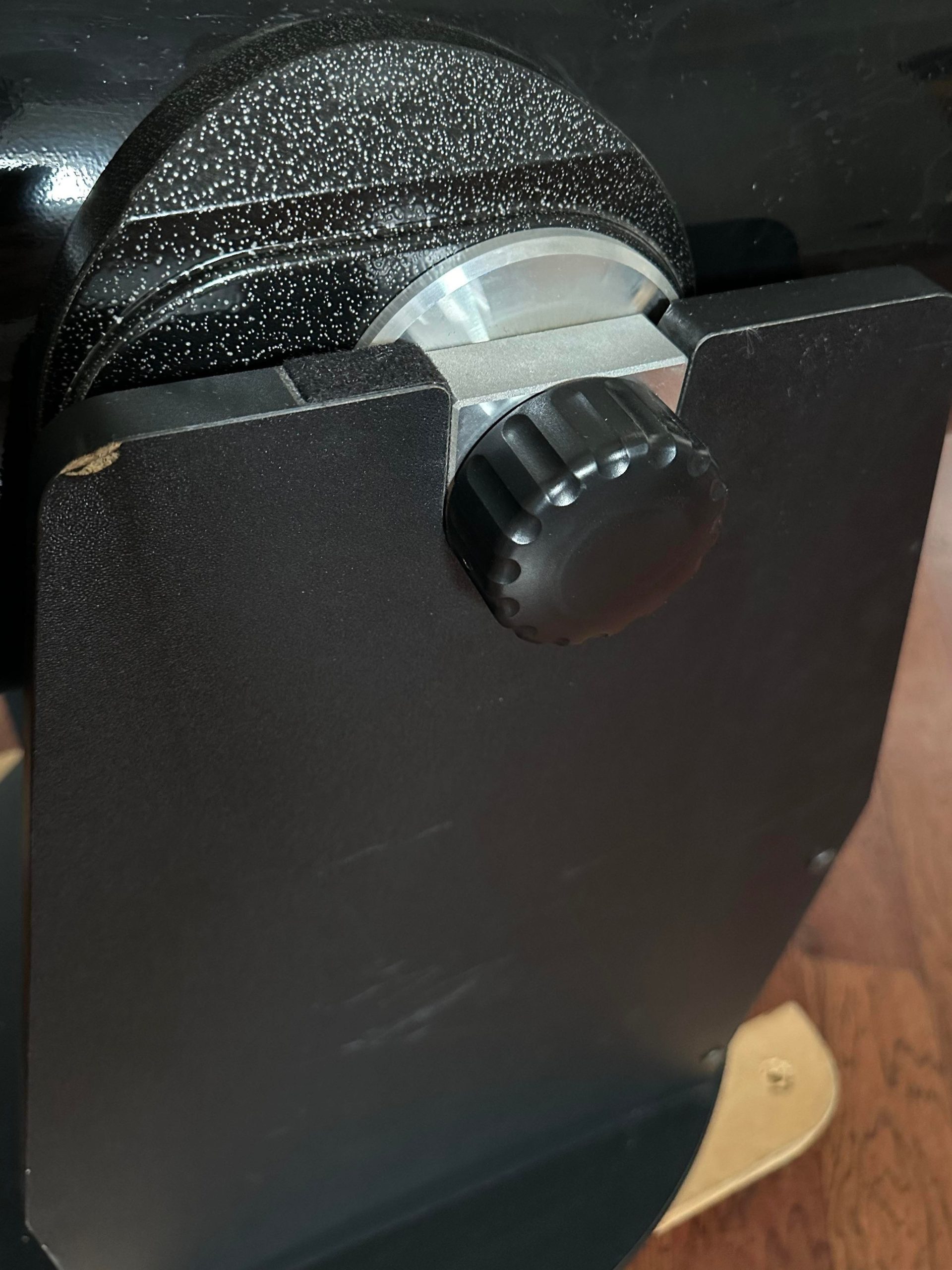 Side of Z12's dobsonian mount showing the altitude bearings and knob